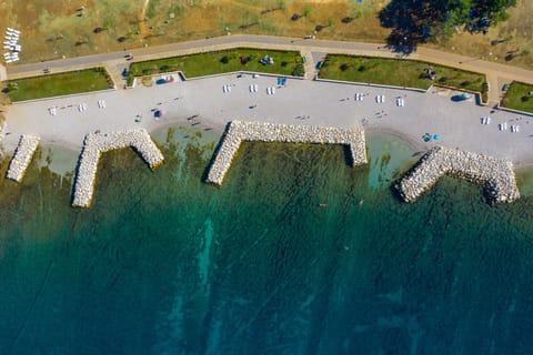 On the beach, sun loungers, beach umbrellas