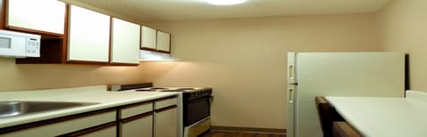 Deluxe Studio, Multiple Beds, Non Smoking | Private kitchen | Full-size fridge, microwave, oven, stovetop