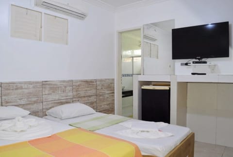 Family Room | Minibar, iron/ironing board, free WiFi, bed sheets