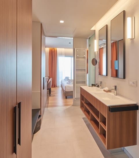 Suite, Lake View (free access SPA) | Bathroom | Shower, rainfall showerhead, eco-friendly toiletries, hair dryer