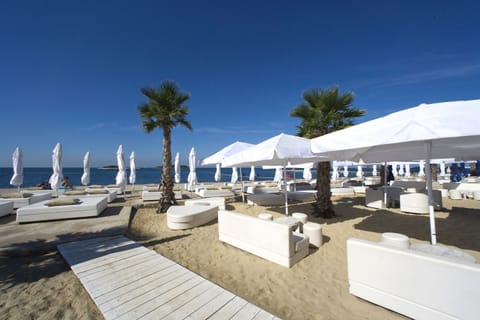 On the beach, sun loungers, beach umbrellas