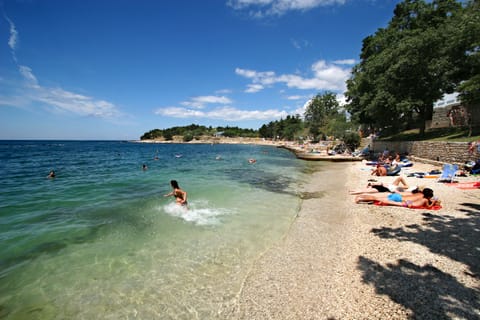 On the beach, sun loungers, beach umbrellas, beach volleyball