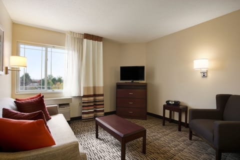 Suite, Non Smoking (One-Bedroom Suite) | Living room | 32-inch flat-screen TV with satellite channels, TV