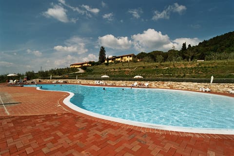 Seasonal outdoor pool, open 9:00 AM to 8:00 PM, pool umbrellas