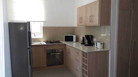 Deluxe Apartment, 2 Bedrooms | Private kitchen | Full-size fridge, microwave, oven, stovetop