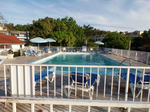 Outdoor pool, pool umbrellas, sun loungers