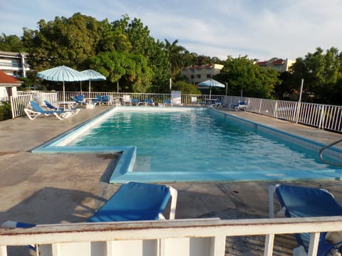 Outdoor pool, pool umbrellas, sun loungers