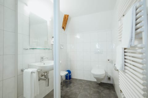 Standard Suite | Bathroom | Hair dryer, towels, soap, shampoo