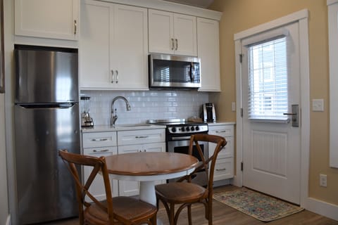 Palm Cottage | Private kitchen | Full-size fridge, microwave, oven, stovetop