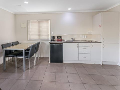 One Bedroom | Private kitchen | Mini-fridge, microwave, coffee/tea maker, electric kettle