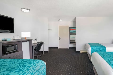 Suite, Multiple Beds, Non Smoking | Desk, blackout drapes, soundproofing, iron/ironing board