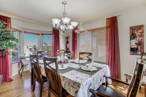 Large windows allow an abundance of natural light to filter into the dining room