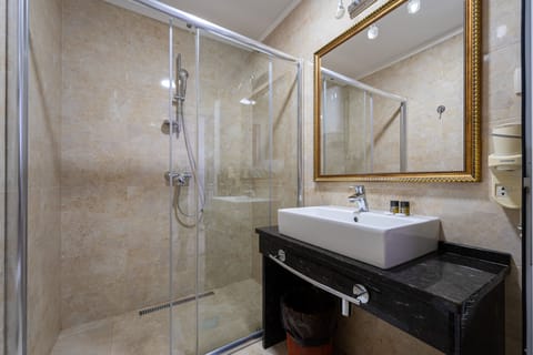 Comfort Studio, Balcony, Beach View | Bathroom | Deep soaking tub, hair dryer, towels