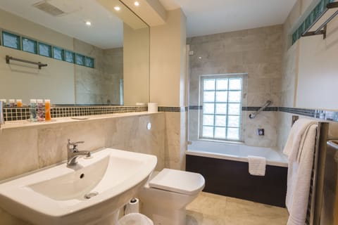 Executive Suite | Bathroom | Designer toiletries, hair dryer, towels