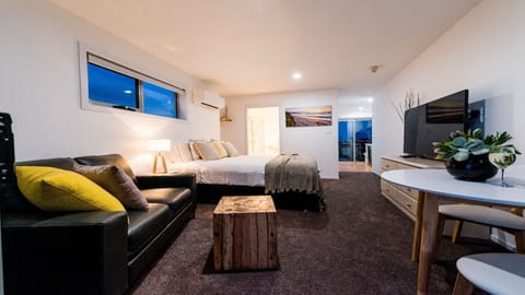 Deluxe Studio Suite, 1 Bedroom, River View | Living room | 55-inch flat-screen TV with premium channels, TV, Netflix