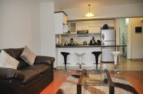 Apartment, 1 Bedroom | Living area | 50-inch Smart TV with satellite channels, TV