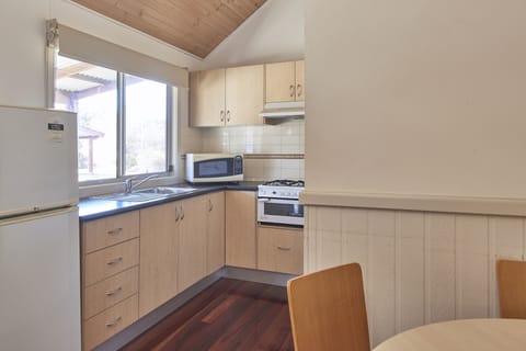 Two Bedroom Miners Hut | Private kitchen | Fridge, microwave, coffee/tea maker, electric kettle