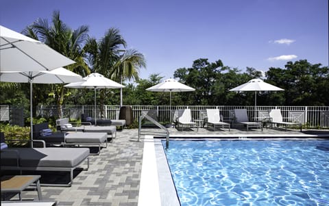 Outdoor pool, open 8:00 AM to 7:00 PM, free cabanas, pool umbrellas