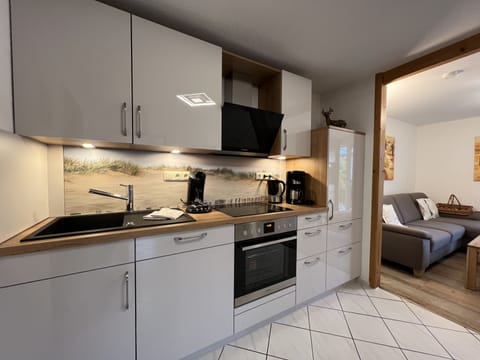 Comfort Apartment, Private Bathroom (Langeoog) | Private kitchen | Full-size fridge, microwave, oven, stovetop