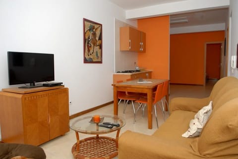 Apartment, 1 Bedroom | Living room | Flat-screen TV