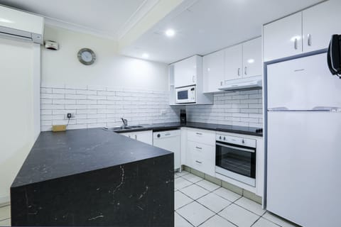 Superior One Bedroom Apartment | Private kitchen | Full-size fridge, microwave, oven, stovetop