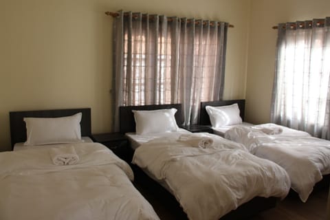 Economy Double Room Single Use, 2 Double Beds, Shared Bathroom, Valley View | Soundproofing, free WiFi, bed sheets