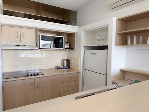 Two Bedroom Apartment with Spa | Private kitchen | Microwave, toaster, cookware/dishes/utensils