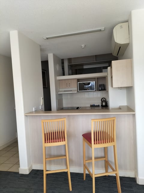 2 Bedroom Apartment with Walk-in Shower | Private kitchen | Microwave, toaster, cookware/dishes/utensils