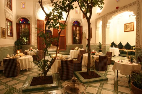 Breakfast, lunch, dinner served; Moroccan cuisine, garden views 