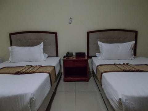 Twin Room, Garden View | In-room safe, individually decorated, individually furnished, desk