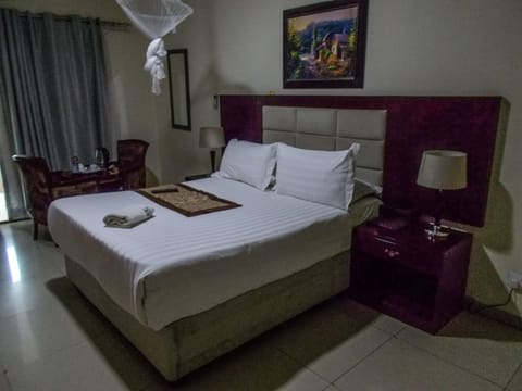 Deluxe Room, Balcony, Garden View | In-room safe, individually decorated, individually furnished, desk