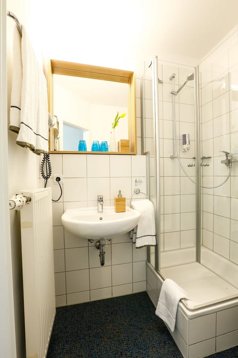 Shower, eco-friendly toiletries, hair dryer, towels