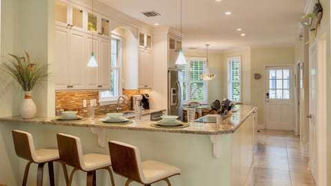 The kitchen bar is perfect for a quick bite or keeping the chef company...