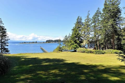 Large lawn which cascades down to the water.