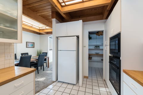 Kitchen with view of pantry and dining room
