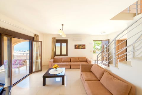 Villa, 6 Bedrooms, Private Pool, Beachfront | Living room | 30-inch flat-screen TV with satellite channels, TV, DVD player