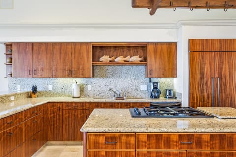 Kitchen with Island, Coffee Maker, and Refrigerator