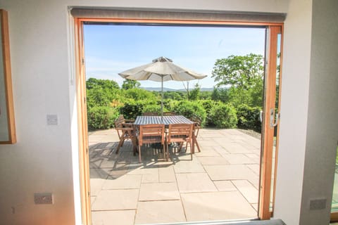 Looking out to south facing patio and fabulous views to distant Kilpatrick hills