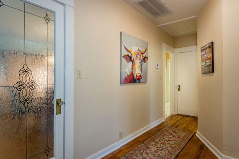 Main Hallway of the Home that connects all Bedrooms with Hardwoo