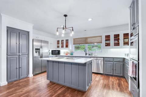 Full kitchen with stainless steel appliances