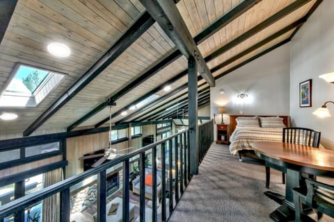 The upstairs loft is open to the living room and doubles as an extra bedroom