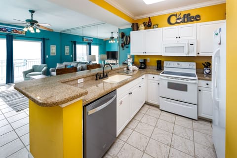 Kitchen - Alternate view of the fully stocked kitchen. All appliances, cookware, and utensils for basic cooking needs.
