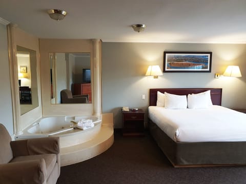 Suite, 1 King Bed, Jetted Tub, River View | Iron/ironing board, free WiFi, bed sheets