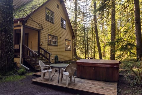 Rockin Rhody Hot Tub - large hot tub with outdoor seating and table.