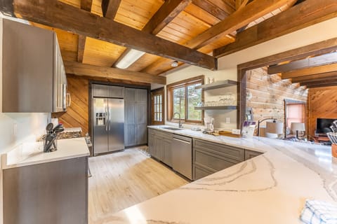 Updated full size kitchen with granite countertops, hardwood flooring and new stainless steel appliances throughout.