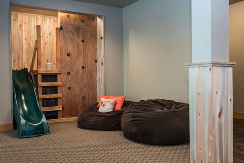 Mini climbing wall and slide