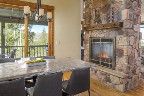 Warm up by the two way fireplace while enjoying dinner