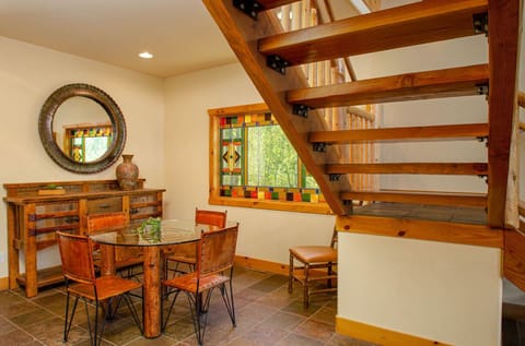 Breakfast nook for four at the bottom of the stairs