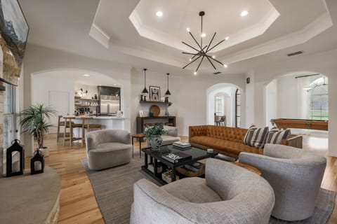 Living Room:  View looking toward kitchen, foyer, pool table room--Open Floorplan so you don't miss a thing.