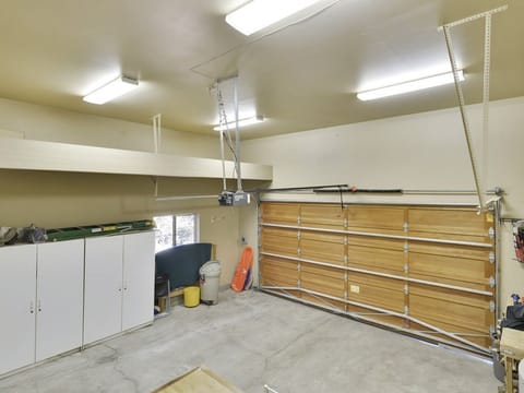 large attached garage with interior stairs into the home